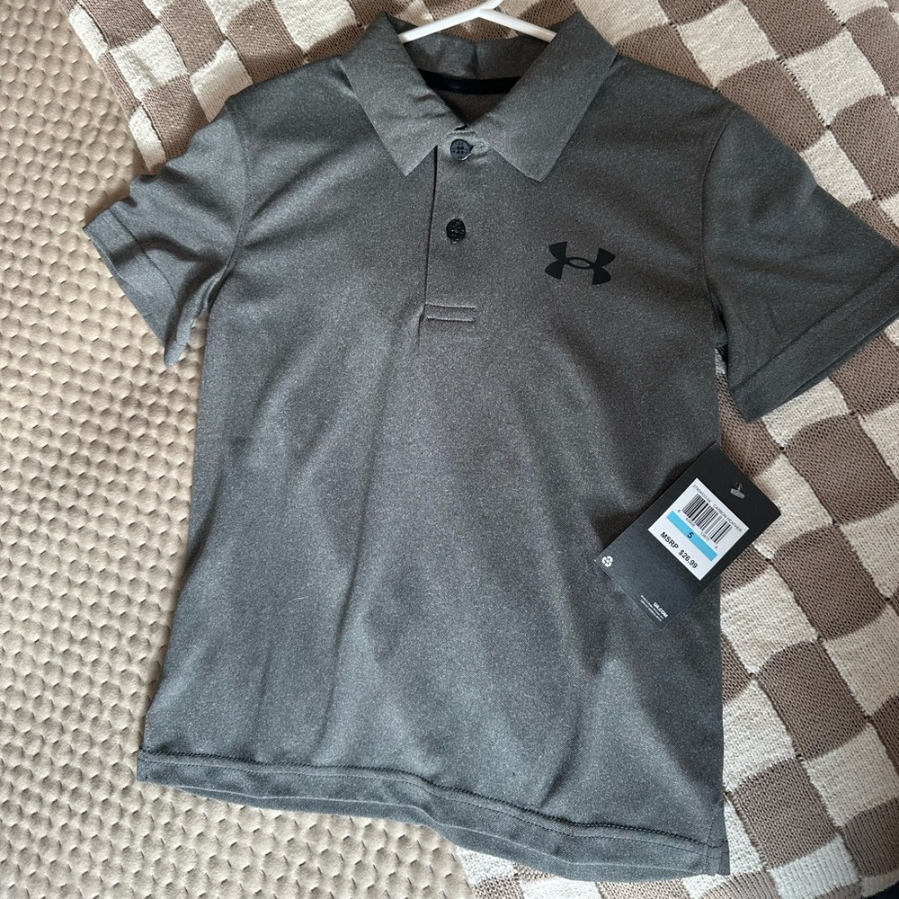 Under Armour Collared Shirt. Grey with black buttons and emblem. NWT. Size 5.